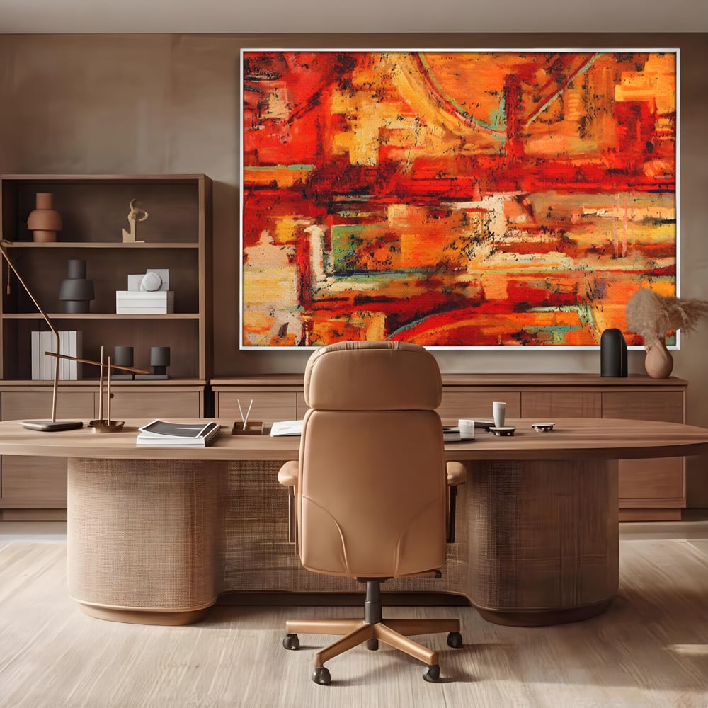 Tablou canvas cu pictura abstracta cu texturi in tonuri de rosu, in rama de aluminiu argintiu, pe perete intr-un birou
